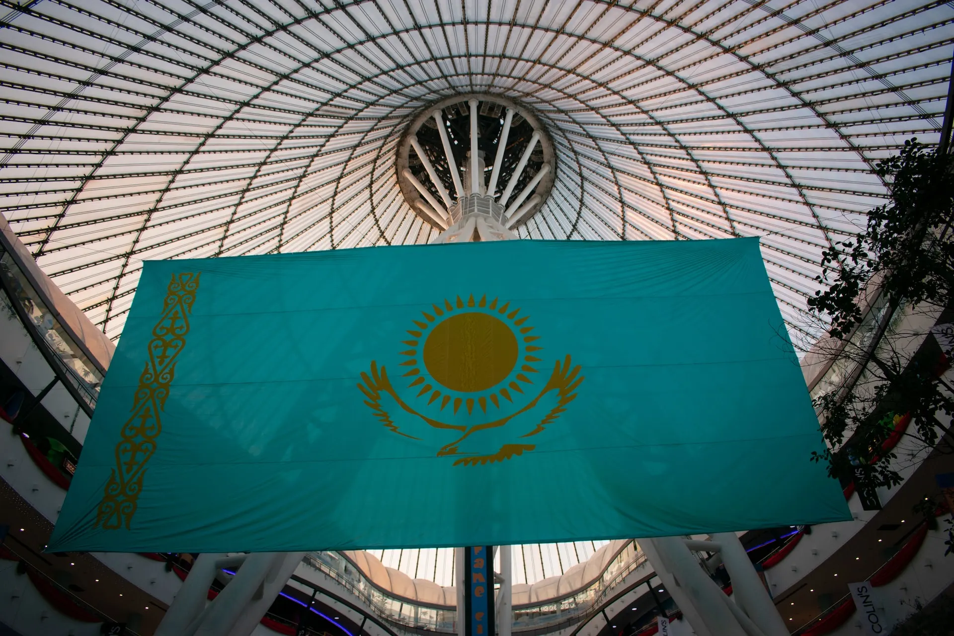 a large flag is hanging in a building in Khan Shatyr, Turan Avenue, Astana, Kazakhstan